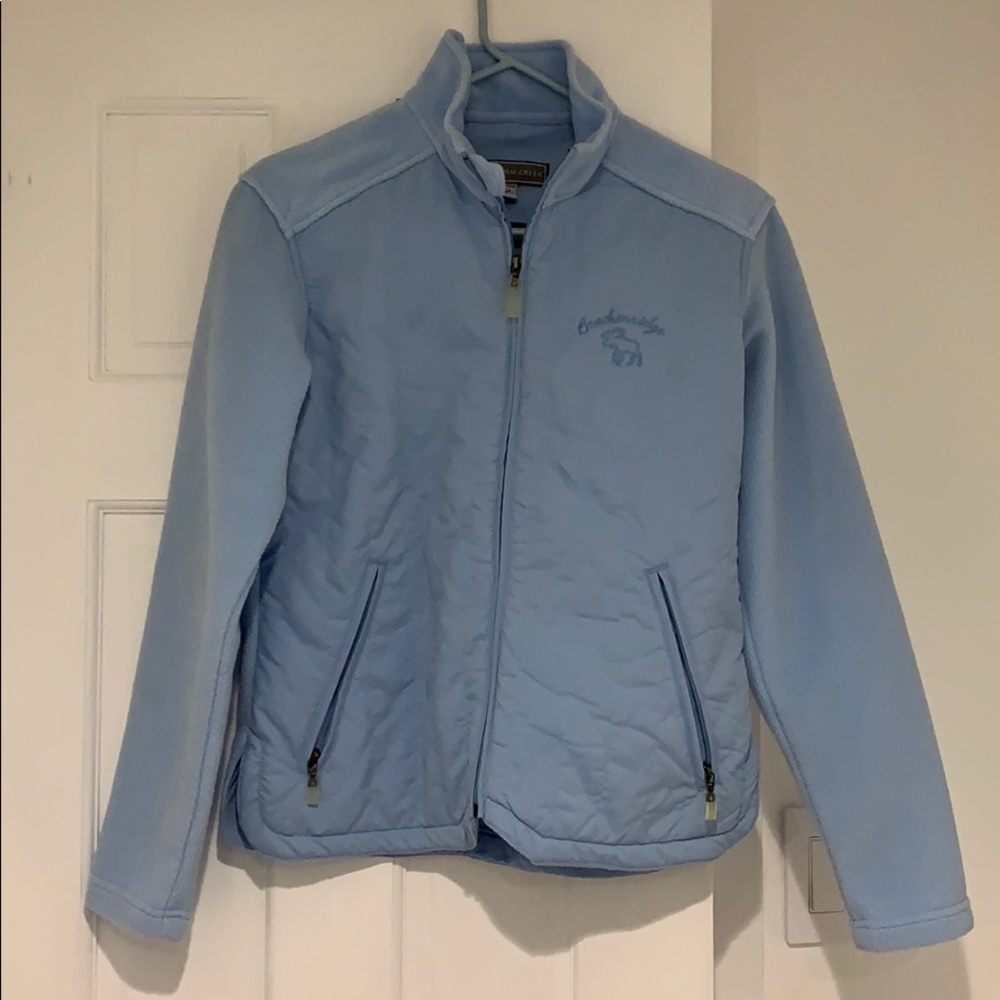 Women’s size extra small light blue fleece jacket.